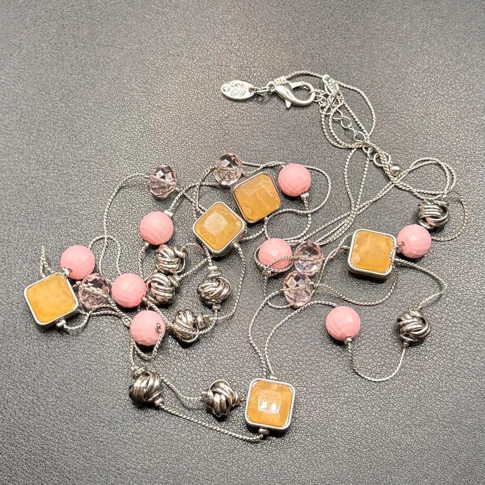 Pink and silver beaded necklace with square amber-colored beads and pink beads